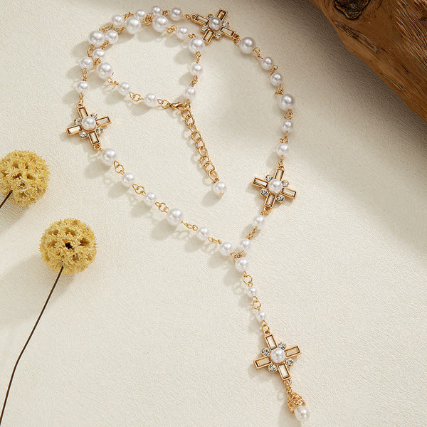 Elegant Cross Rosary Necklace with Gold-Tone Details & White Beads: A Reminder of Divine Grace