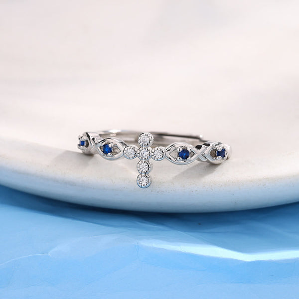 Dainty Cross Ring with Blue Zircon Accents: A Symbol of Faith and Serenity